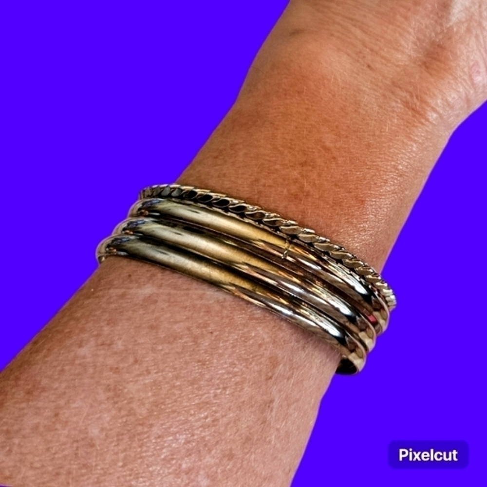 Stack of Four Silver Plated Bangle Braceletsa